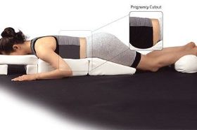 NRG Pregnancy Body Positioning System - Pregnancy Bolsters & Cushions. The NRG Pregnancy Body Positioning System helps maintain complete muscular-skeletal alignment for your pregnant clients while providing exceptional face-down comfort as well. Its easy to carry design is ideal for in home massage or for use in your professional office. 18" W x 41" L x 5" D Instructions: To help protect the cloth of this product from unnecessary soiling, use a towel or sheet as a barrier between patient and cushions. Washing Instructions: Cushion: Do not wash. Do not dry. Cover: Hand wash cold, mild soap and hang dry. *Please Note: Please consult with your doctor, or other qualified health care professional before using this product.