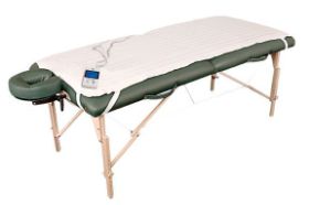 NRG DIGITAL MASSAGE TABLE WARMER, 30". This digital massage table warmer is a great addition to your portable or stationary massage table. This full sized table warmer provides even warmth from one end of the massage table to the other and has no weight limit. Elastic bands secure the warmer to your table top while the user-friendly, digital controller allows for quick and easy temperature changes. The table warmer is 100% Polyester. Includes timer and preheat setting. Internal temperature range is 98.6 to 140 degrees Fahrenheit. Each bar represents about 4 degrees of incremental heat. Plug on warmer is two prong, and measures 9 from plug to controller and 2.5 from controller to pad. This is not hospital grade. 30" W x 73"L. Watts: 120, Volts: 120. Replacement cord sold separately.