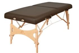 Massage Table Nova Color: Espresso Patented SlideLock - Designed to offer even greater strength than our cable lock system, features the strongest cables on the market. Patented IntegraHinge - Oakworks exclusive design integrates the attachment of the bracing system to offer incredible strength and lighter weight that no piano hinge can match. Engraved Wooden Knobs - Low profile design with built in grip band is easy to use and won't get in your way like plastic knobs. UniLock - Super quick, easy to use system folds out of the way for shiatsu and won't rip your sheets or mark your floor. Ultimate Access End Panel & Shiatsu Cables - Our unique system allows you to get your legs under the table at the height you work, offering the best access on the market. The shiatsu cables allow the table to be laid flat on the floor. Width: 29 in., 31 in. or 33 in. Length: 73 in. Height Range: 24 in. - 34 in. Foam: Plush, Aero-Cel Fabric: Premium, PVC free TerraTouch™ Medical Grade Fabric is ISO 10993 Certified Weight Capacity: 550 lb. Weight: 29-36 lbs